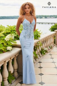 You will certainly turn heads in this dazzling steel blue, V-neck prom dress! With its intricate beaded lace and intricate lace-up back, it  is sure to get you noticed. It features a bit of tulle for a touch of femininity so you can twirl around with all night.
