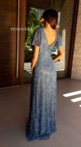 Elegance meets style come together with this sequin beaded steel blue color Mother of the Bride / Groom dress.  This dress features a fitted to flowing body, deep V-neck front and back and flutter sleeves. 