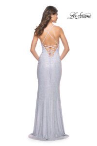 This amazing light periwinkle jersey prom dress is fully embellished with rhinestones, a draped V- neckline, spaghetti straps and complimented with ruching. The back also features ruching along the low V-cut zipper with straps elegantly criss crossing onto the back which lead into a beautiful laced back to create a dramatic and beautiful style.