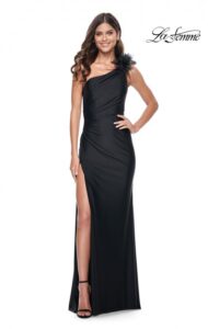 Unique and form fitting, this one shoulder black jersey prom dress features a feather and tulle detail with ruching, high side slit and back zipper closure. This dress is also styling and beautiful  for weddings and other elegant occasions. This dress is also available in royal blue.
