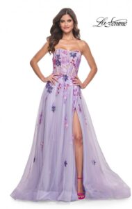 Beautiful and timeless is this lavender A-line, very flowing and fitted, tulle dress with strapless top. The multi colors of the sequin lace applique that cascade down the skirt is breathtaking, and complemented with a high side slit. The illusion boning on the back of the dress also adds to the expressive charm of this dress.