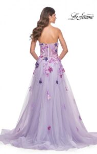 Beautiful and timeless is this lavender A-line, very flowing and fitted, tulle dress with strapless top. The multi colors of the sequin lace applique that cascade down the skirt is breathtaking, and complemented with a high side slit. The illusion boning on the back of the dress also adds to the expressive charm of this dress.