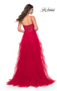 Classy and flowing is our red ruffle tulle skirt prom dress with a high slit. The dress features an illusion rhinestone bustier fishnet top and back zipper closure. You certainly will radiate lots of color and style in this gorgeous dress.