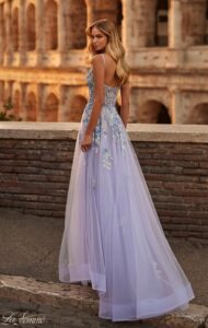 Elegant and flowing is this lavender and gray tulle A-line prom dress. The dress features a V-neckline, high side slit, two tone lace applique throughout the dress and an Illusion bodice front and back. The zipper closure completes the exquisite detail of this dress.