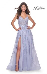 This lovely A-line lavender prom dress features beautiful and unique sequin lace applique. The V-neckline and illusion bodice with boning, high slit, and spaghetti straps which lead to the back of the dress to lace up the ties, altogether make this a dress a showstopper for your prom.  The back zipper closure complete the design of this chic and decorative dress.