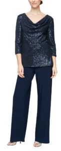 With this navy blue pantsuit, experience timeless sophistication in this beautiful pantsuit. Its cowl neck tunic sequin blouse and straight leg jersey pant provide chic, yet comfortable and modest coverage for a perfect evening look.