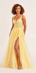 This distinctively classy yellow A-line prom dress features glitter tulle, lace appliques, and sequin tulle 