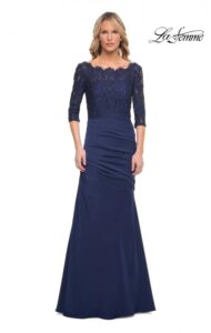 Captivating and classy, this navy blue colored jersey Mother of the Bride / Groom dress features a beautifully beaded lace bodice and a skirt with elegant asymmetrical gathering. A back zipper closure complete the design of this gorgeous dress.