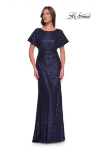 Graceful and gorgeous is our sequin dress for the Mother of the Bride / Groom. It is available in black or navy and features ruching at the waist and dolman sleeves. A back zipper closure complete the design of this stunning dress.