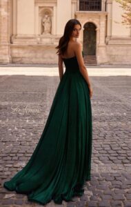 La Femme Prom Dress 32382 This unique, emerald green, strapless dress features a textured metallic chiffon fabric that is flowy and elegant. The bodice features a criss cross design with sweetheart neckline and back zipper closur