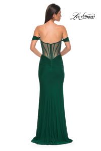 Simple and chic, this emerald net jersey dress features a modified sweetheart neckline and draped off the shoulder straps. The waist features an illusion design with exposed boning. The skirt has ruching and a slit, with back zipper closure. This dress is also available in dark berry and black colors.