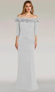 Dress shown in black and is also available in blush, cobalt, and silver. Step into timeless elegance with this off-the-shoulder gown that hugs your curves in all the right places, accentuated with delicate 3D floral accents and a sleek silhouette.